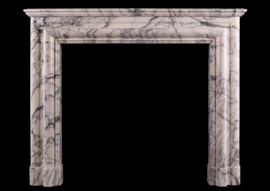 An architectural fireplace in Arabescato marble