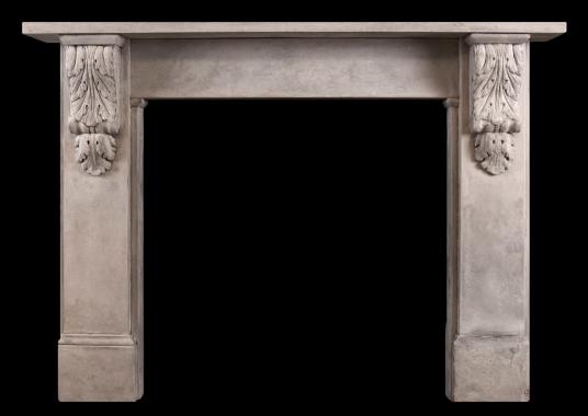 A reclaimed stone fireplace in the mid Victorian manner