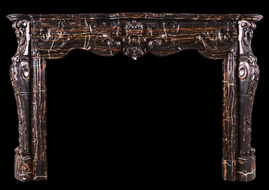 A striking Louis XV style marble fireplace