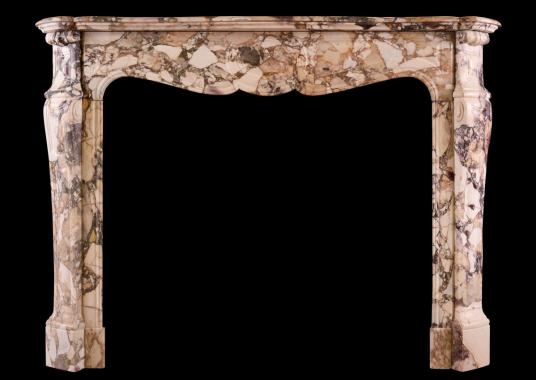 A French Louis XV style fireplace in Br&egrave;che de B&eacute;nou marble
