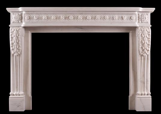 A French white marble fireplace in the Louis XVI manner