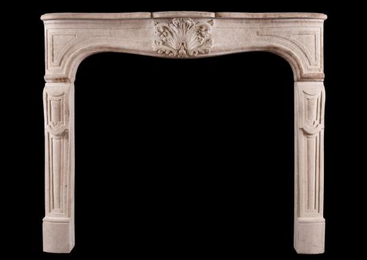 A French limestone fireplace in the Louis XV manner