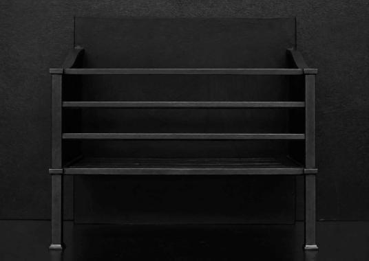 A simple steel firegrate in a blacked lead finish