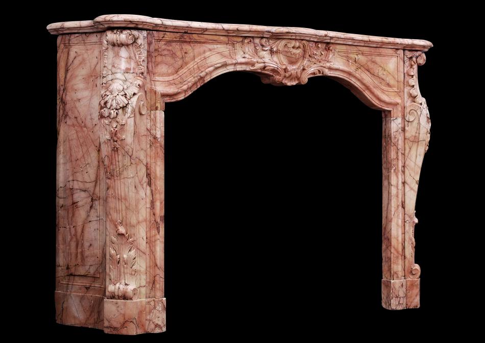 An 18th century French transitional Louis XIV/XV marble fireplace