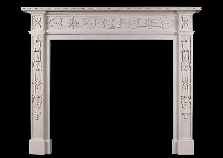 An 18th century style carved white marble mantel piece