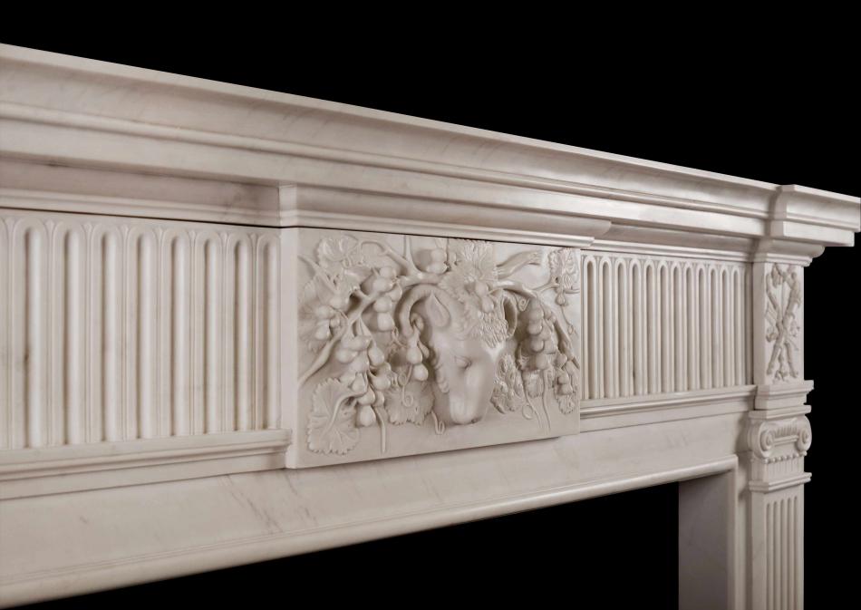 A Georgian Style White Marble Chimneypiece with Rams head to centre plaque