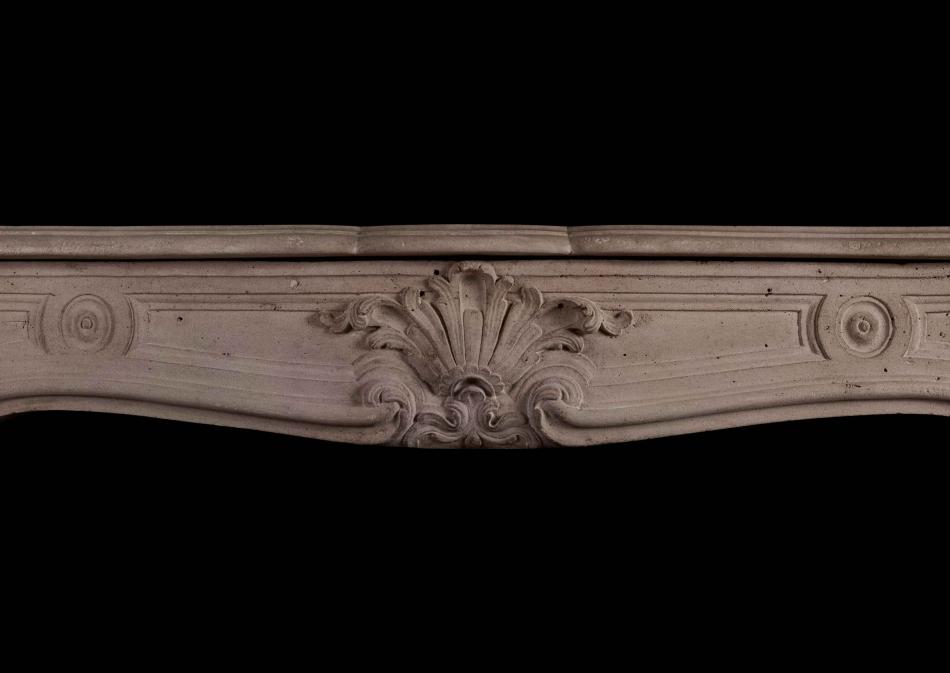 A French Louis XV antique stone fireplace