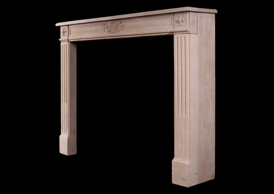 A French Louis XVI Style carved limestone fireplace
