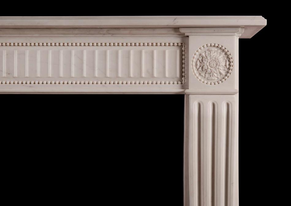 An English white marble fireplace in the Regency style