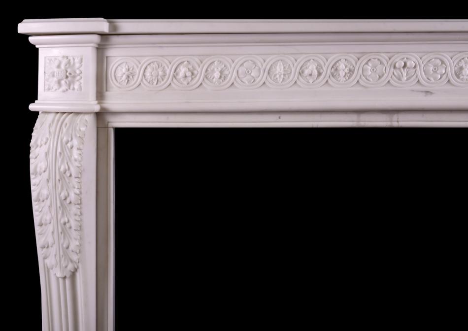 A carved French fireplace with guilloche frieze