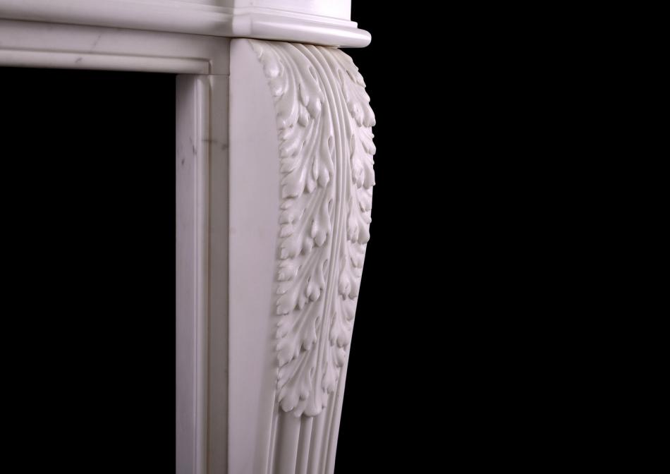 A carved French fireplace with guilloche frieze