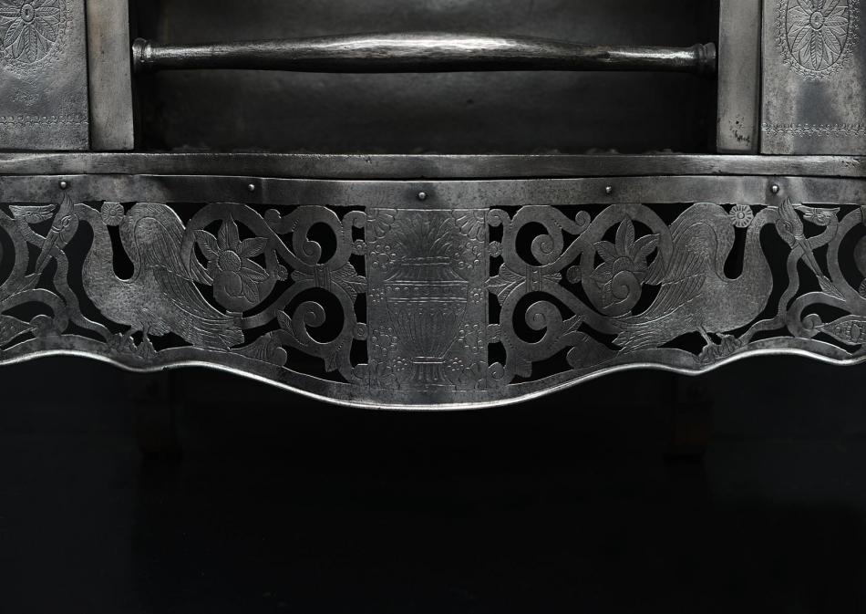 A Georgian style polished steel firebasket