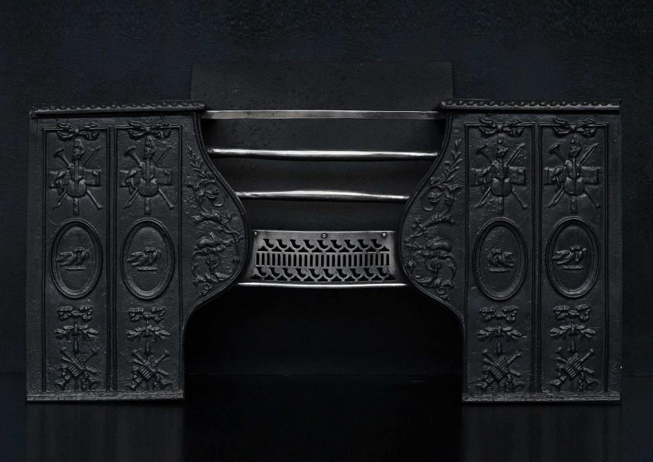 An early 19th century cast iron hob grate