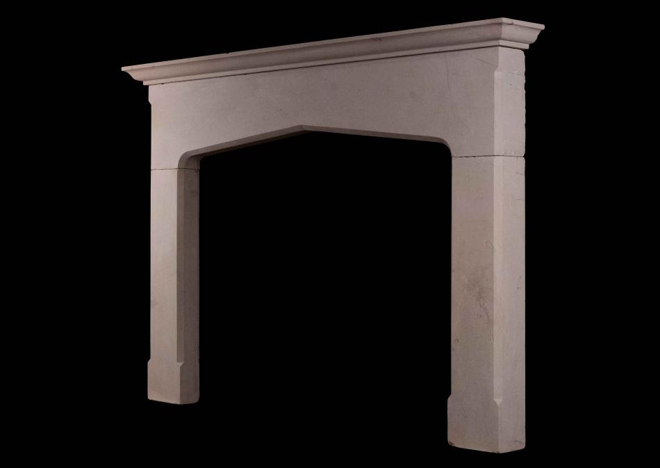 An English Bath stone fireplace in the Gothic manner