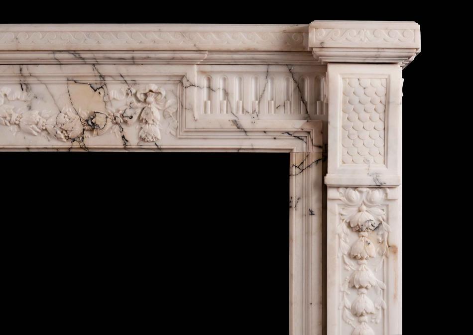 A French Louis XVI Style Fireplace in light Pavonazza marble