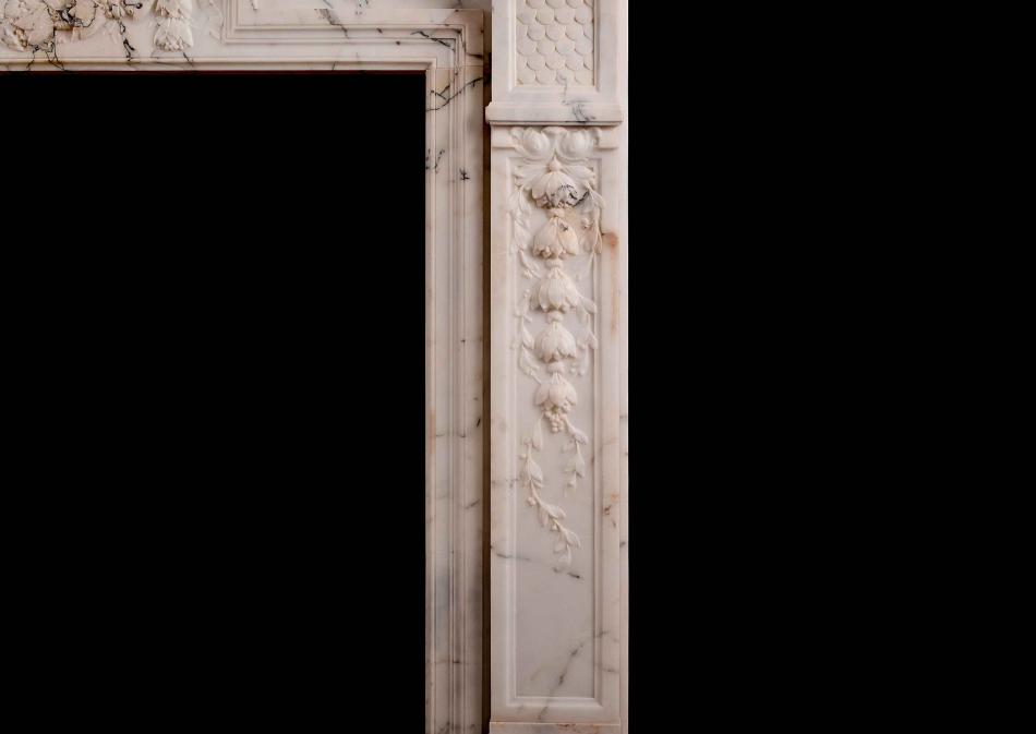A French Louis XVI Style Fireplace in light Pavonazza marble