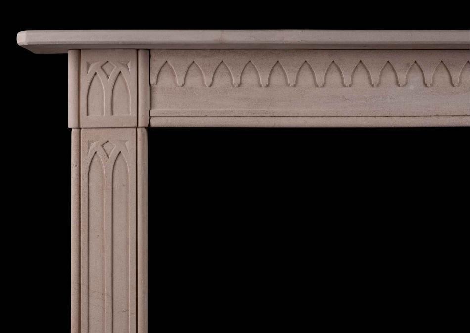 A late Georgian English limestone fireplace in the Gothic style