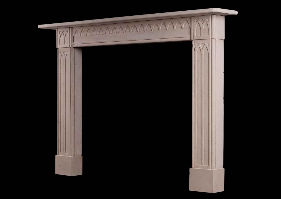 A late Georgian English limestone fireplace in the Gothic style