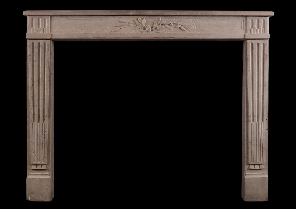 A Louis XVI style limestone antique fireplace