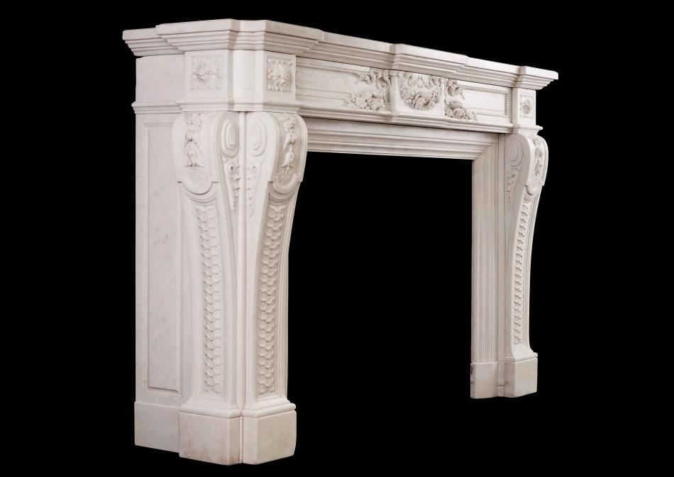 A very finely carved French Louis XVI Style Statuary Marble Fireplace