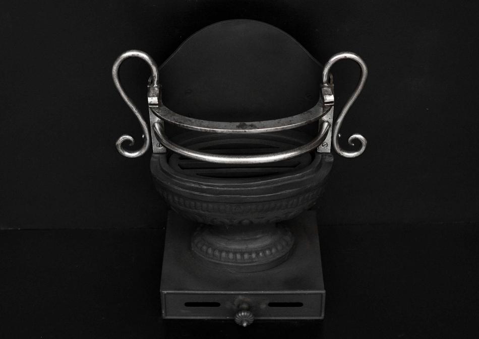 A Regency style cast iron urn grate
