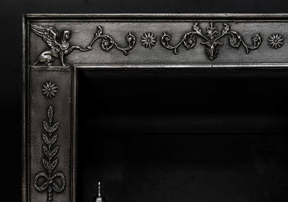 An English Regency polished cast iron register grate