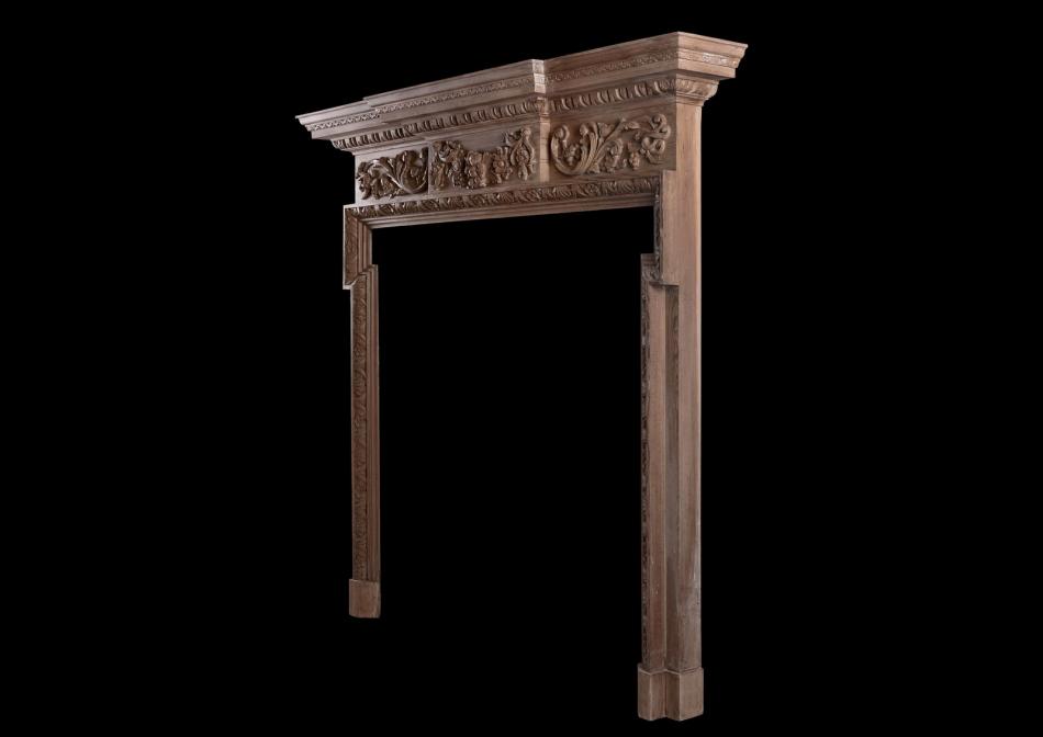A carved English pine fireplace