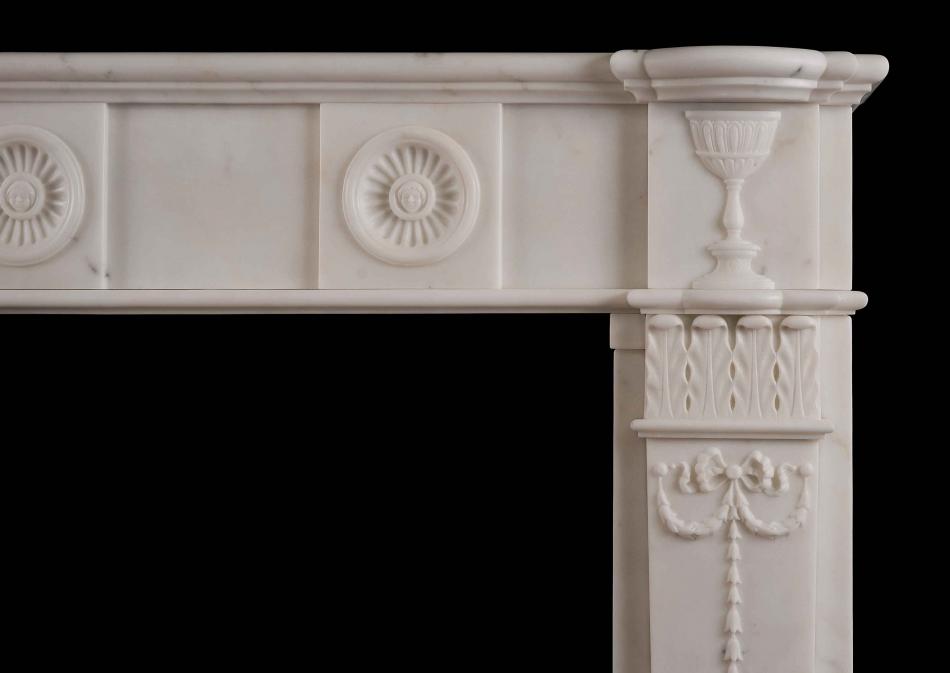 An English Regency style antique fireplace in Statuary marble
