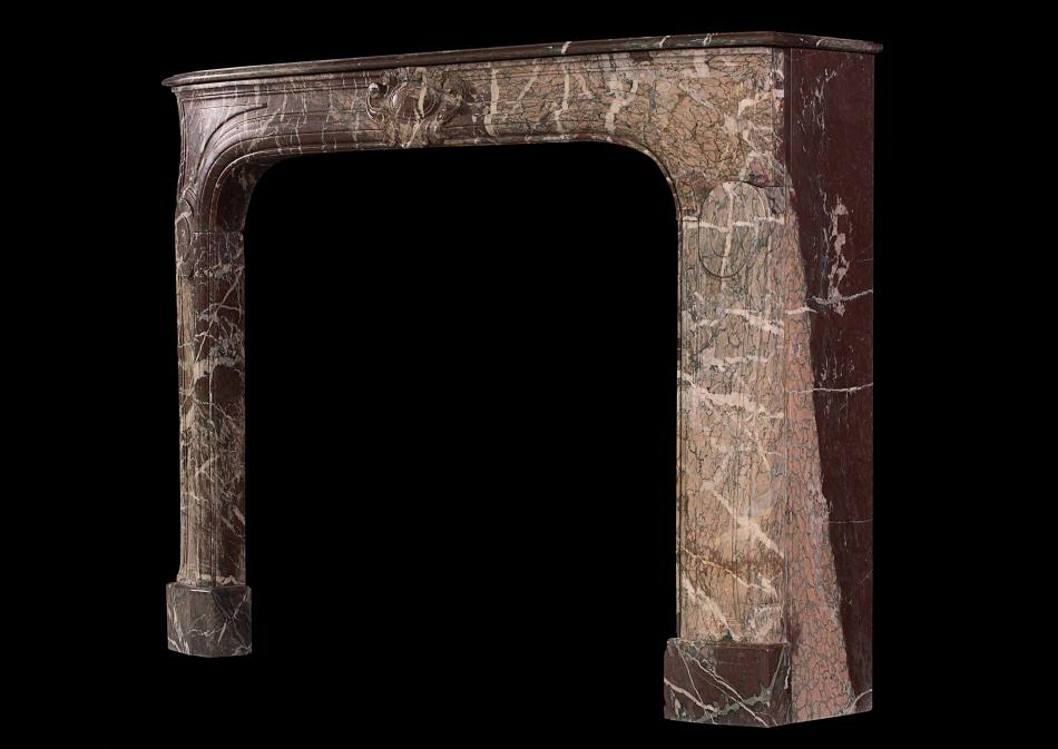 An 18th century French Louis XIV Ribboned Campan marble fireplace