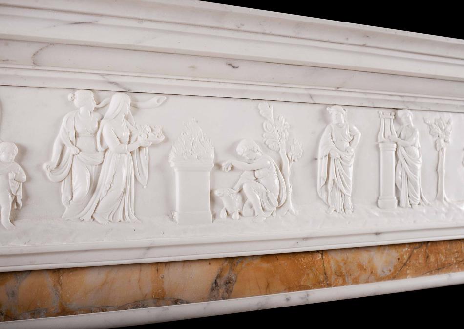 A Neo-Classical English Statuary marble fireplace with Siena inlay