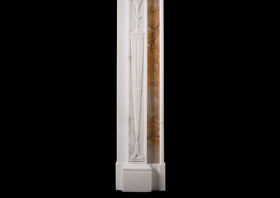 A Neo-Classical English Statuary marble fireplace with Siena inlay