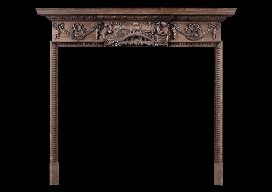 An early 19th century pine fireplace featuring Aesop's Fable
