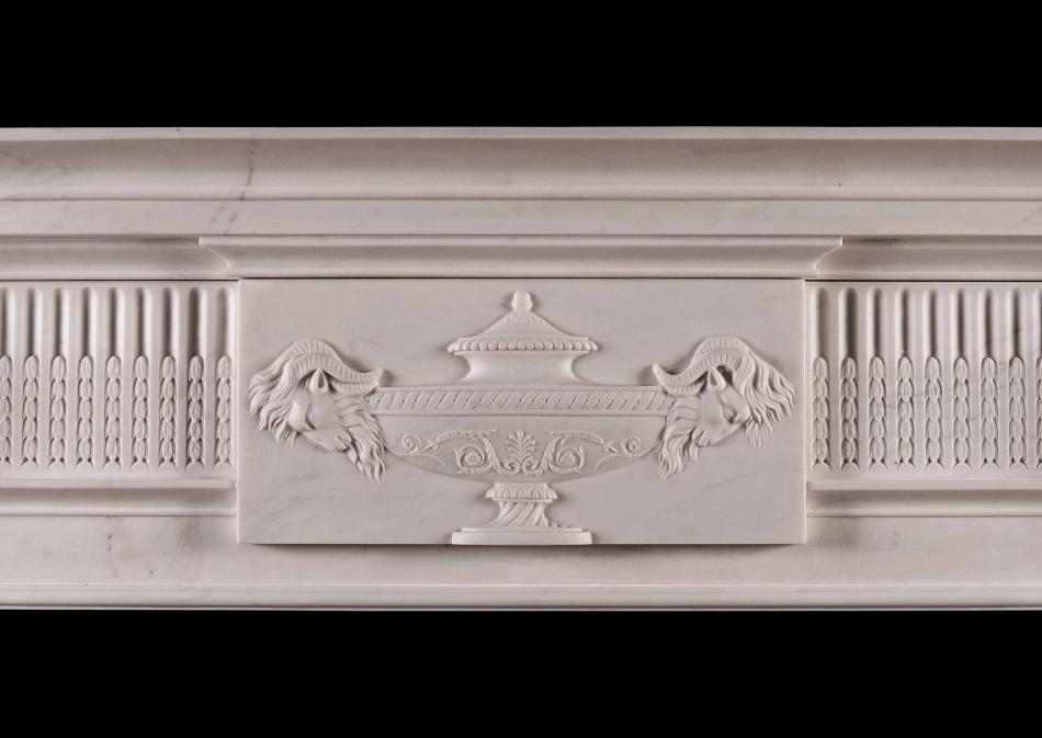 A Georgian style white marble fireplace with carved brackets