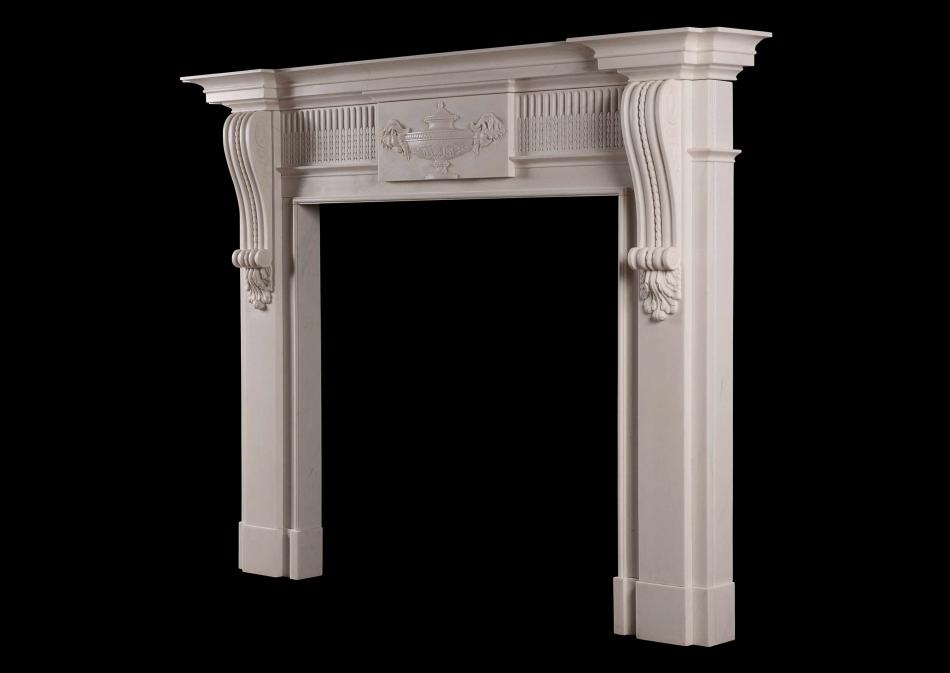A Georgian style white marble fireplace with carved brackets