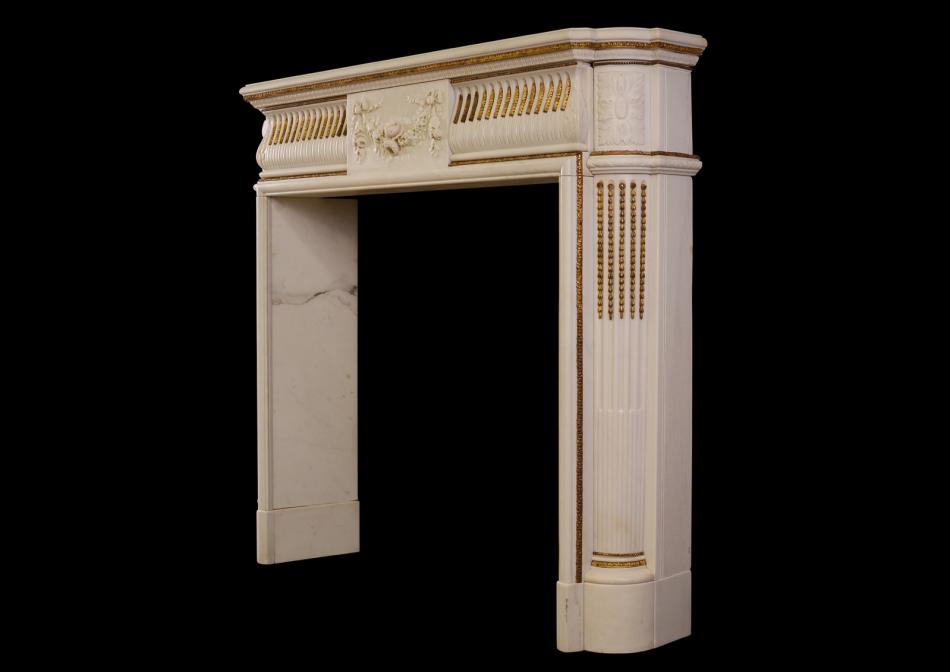 An English Regency Statuary marble fireplace with inlaid brass ormolu