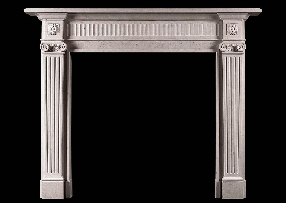 An elegant Georgian style limestone fireplace
