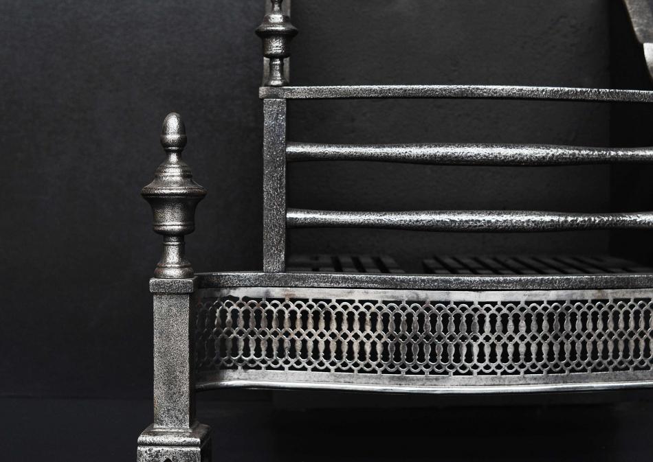 A polished cast iron firegrate in the Georgian style