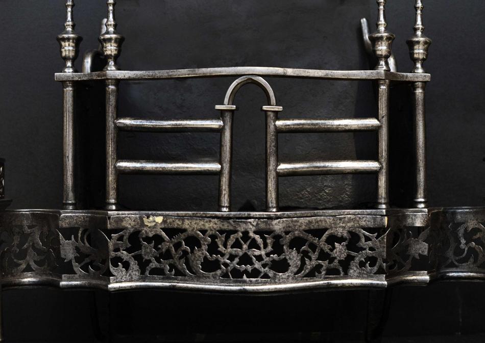 A period, mid Georgian steel firegrate in the manner of Thomas Chippendale