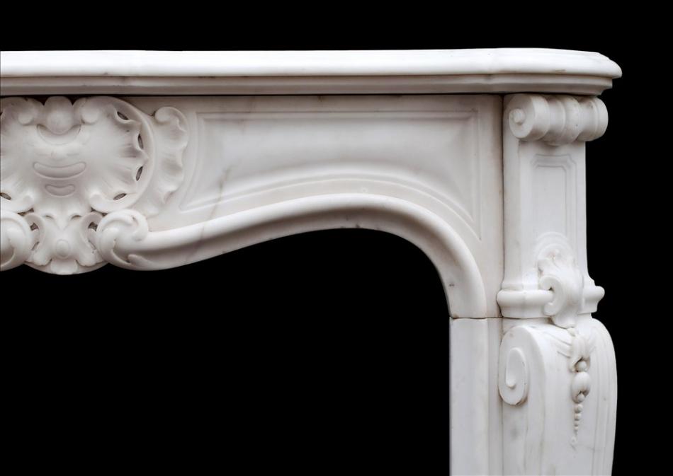 A petite French Louis XV style Statuary marble fireplace
