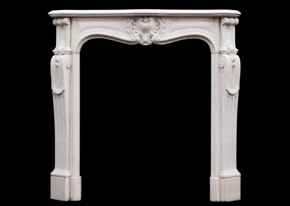 A petite French Louis XV style Statuary marble fireplace