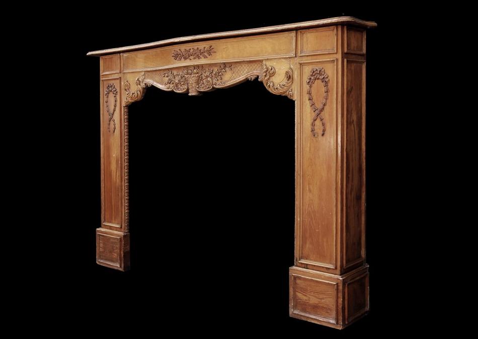 A late 19th / early 20th century English carved wood fireplace