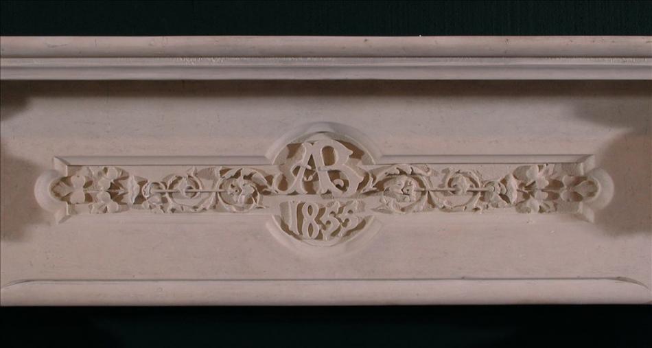 A 19th century English carved limestone fireplace in the Gothic taste