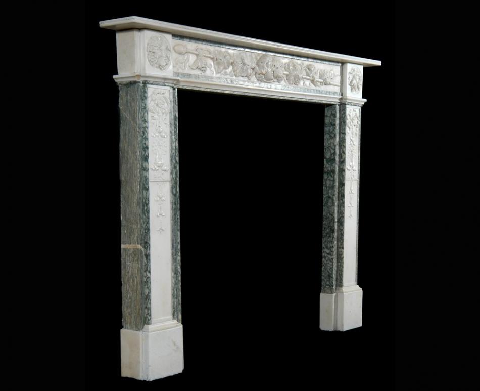 A 19th century English Statuary and Vert d'Estours marble fireplace