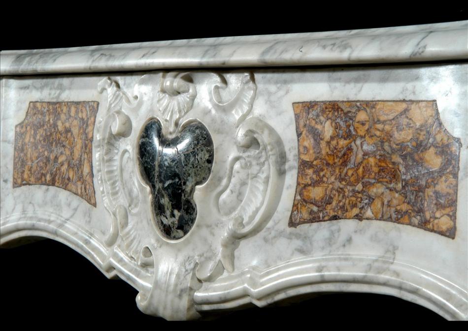 An 18th century French Provençal Carrara marble fireplace