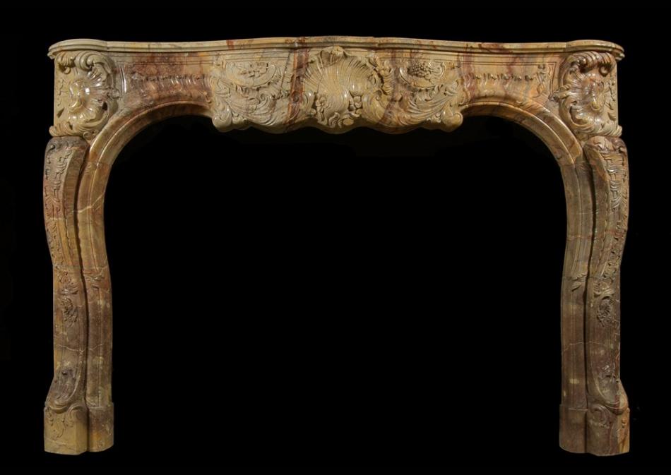 A superb quality French Louis XV style carved Sarrancolin marble fireplace
