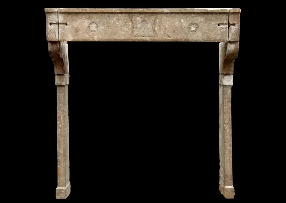 A large 18th century French Louis XVI stone fireplace