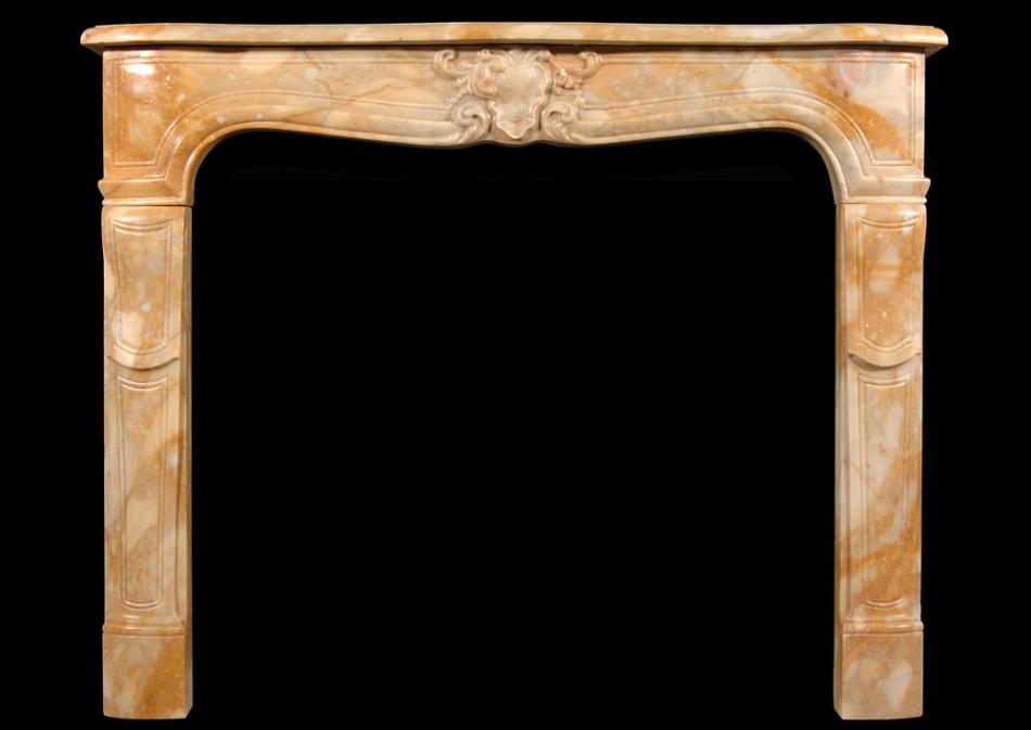A 19th century Louis XV style Siena marble fireplace