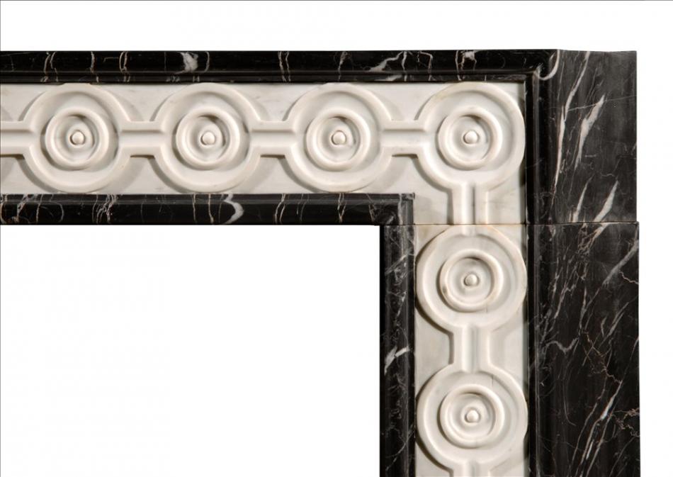 An English Nero Marquina marble fireplace with inlaid Statuary