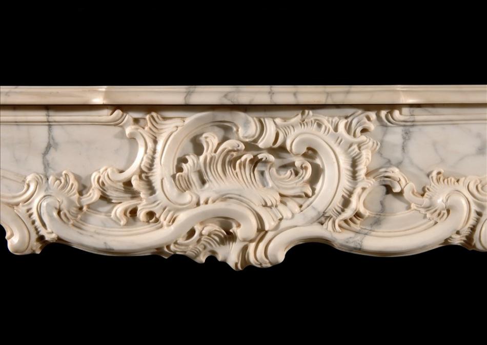 A French Provençale style Arabescato marble fireplace