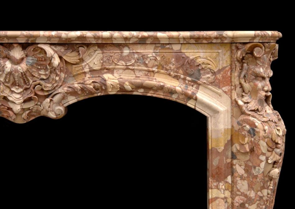 An unusual French transitional style Breche d'Alep marble fireplace